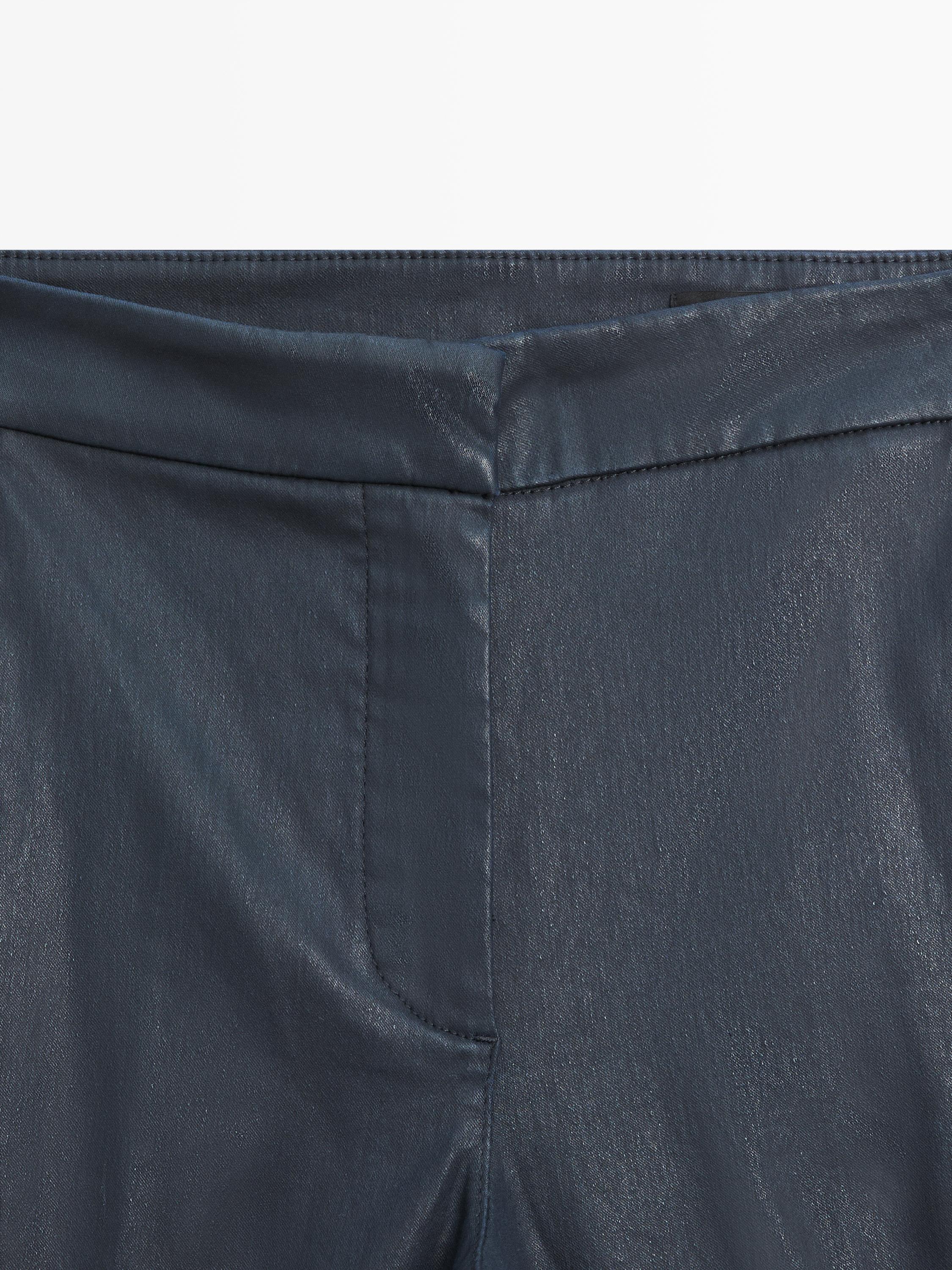 Waxed flare fit trousers